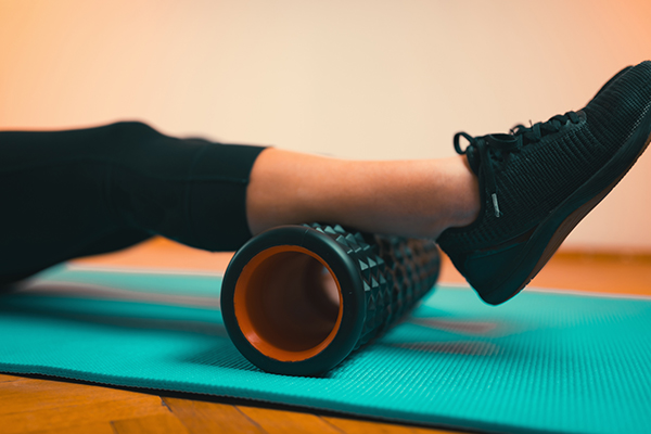 leg on foam roller